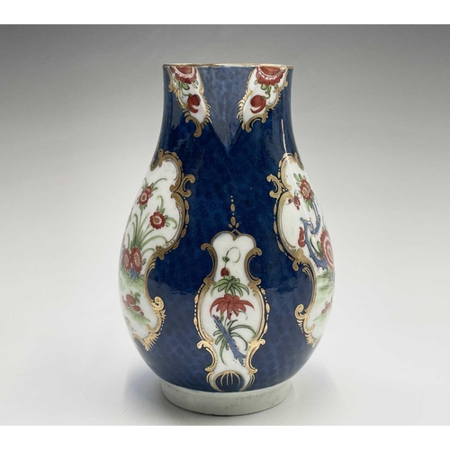 908 - A Worcester jug, circa 1770, the blue scale ground decorated with gilt edged floral panels, crescent... 