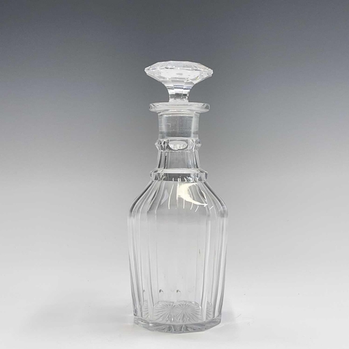 911 - A pair of Regency triple ring neck glass decanters and stoppers, with faceted and fluted decoration,... 