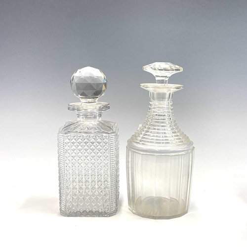 911 - A pair of Regency triple ring neck glass decanters and stoppers, with faceted and fluted decoration,... 