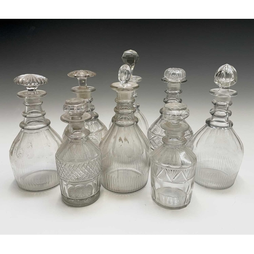 912 - A George III triple ring neck glass decanter and stopper, height 25cm, together with seven other dec... 