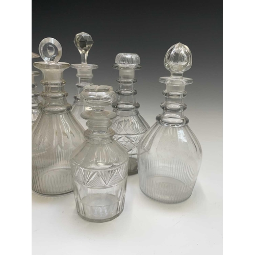 912 - A George III triple ring neck glass decanter and stopper, height 25cm, together with seven other dec... 