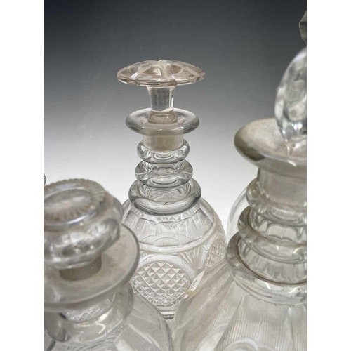 912 - A George III triple ring neck glass decanter and stopper, height 25cm, together with seven other dec... 