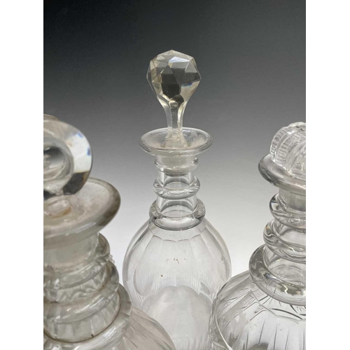 912 - A George III triple ring neck glass decanter and stopper, height 25cm, together with seven other dec... 