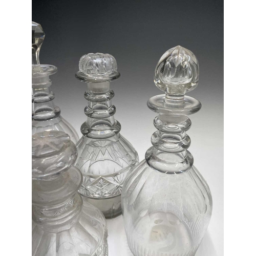 912 - A George III triple ring neck glass decanter and stopper, height 25cm, together with seven other dec... 