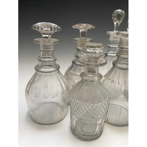 912 - A George III triple ring neck glass decanter and stopper, height 25cm, together with seven other dec... 