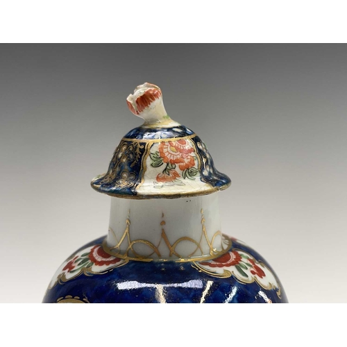 914 - A Worcester porcelain tea caddy and cover, circa 1780, of fluted ovoid form, decorated with Kakiemon... 