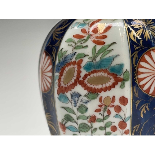 914 - A Worcester porcelain tea caddy and cover, circa 1780, of fluted ovoid form, decorated with Kakiemon... 