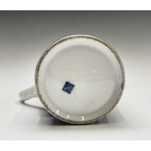 915 - A Continental porcelain mug, in the Worcester style, the blue scale ground with panels of an exotic ... 