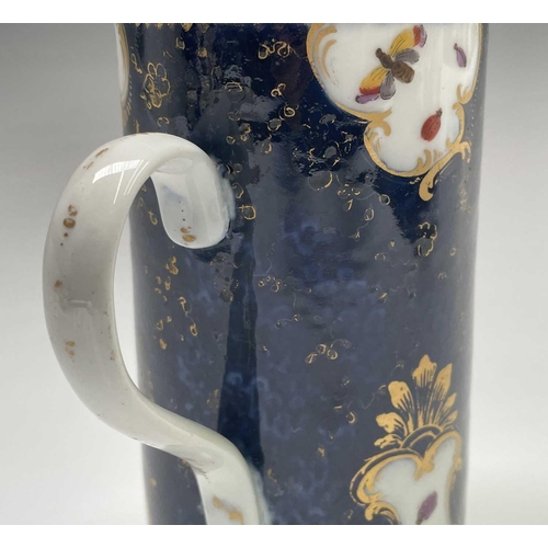 915 - A Continental porcelain mug, in the Worcester style, the blue scale ground with panels of an exotic ... 