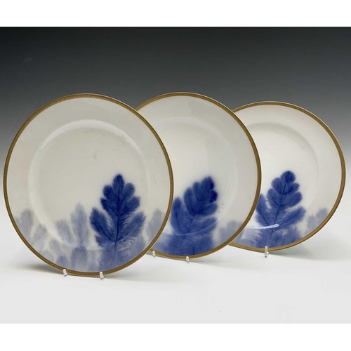 917 - A set of six Japanese Okura porcelain plates, painted with pine branches within gilt borders, diamet... 