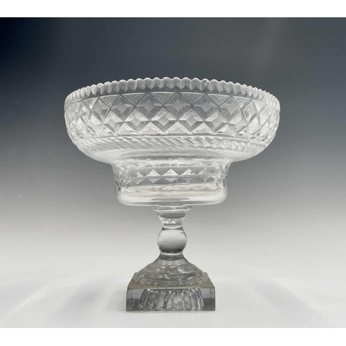 921 - A Georgian cut glass pedestal bowl, with serrated rim, hobnail cut lozenges and lemon squeezer base,... 