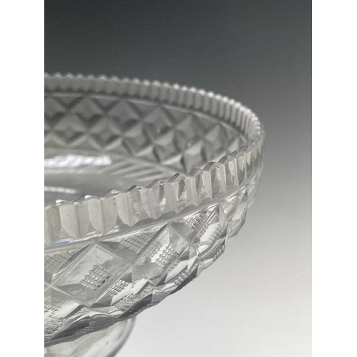 921 - A Georgian cut glass pedestal bowl, with serrated rim, hobnail cut lozenges and lemon squeezer base,... 