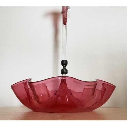 925 - A Victorian cranberry glass single spill epergne, circular base with a frilled edge, height 53cm.