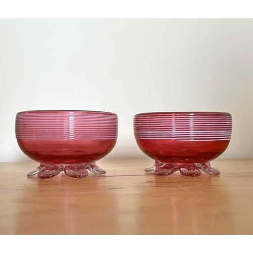 926 - A Victorian cranberry glass bowl with applied white trailing decoration, diameter 14cm, together wit... 