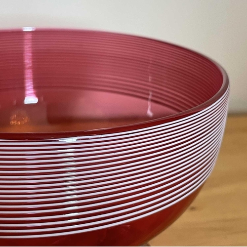 926 - A Victorian cranberry glass bowl with applied white trailing decoration, diameter 14cm, together wit... 