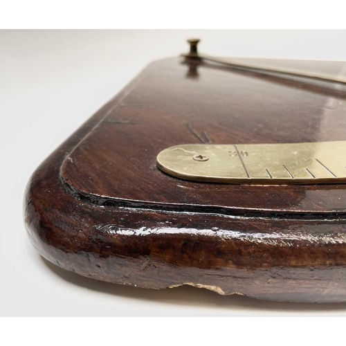 93 - A ship's brass inclinometer, 20th century, on a stained wood base, height 48.5cm.