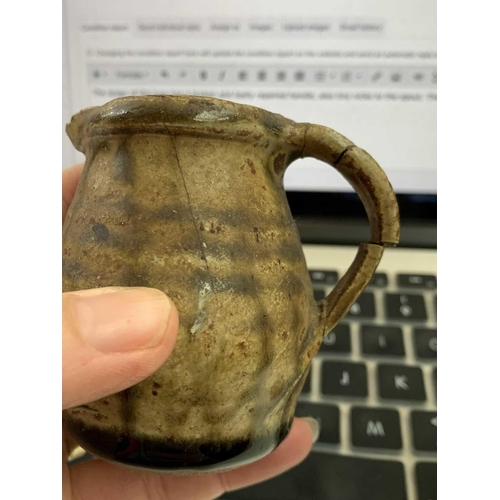 939 - Leach Pottery, A Bill Marshall small jug, with incised decoration below the spout, personal and St I... 