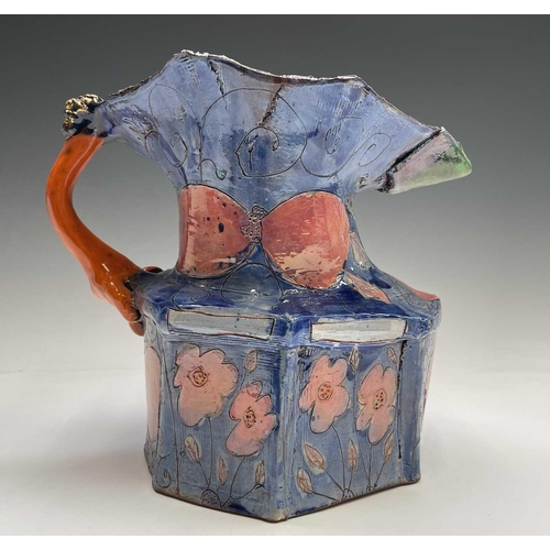 943 - Linda Styles, a contemporary studio pottery jug, with demonic mask handle and of typical misshapen f... 