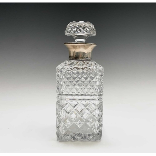 944 - A silver mounted cut glass decanter and stopper, of square section, height 24cm.