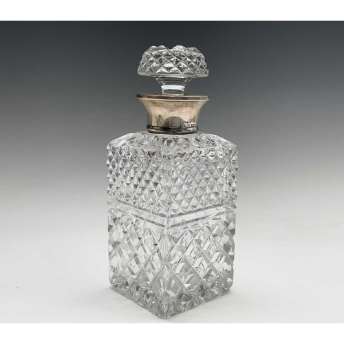 944 - A silver mounted cut glass decanter and stopper, of square section, height 24cm.