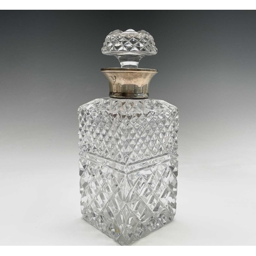 944 - A silver mounted cut glass decanter and stopper, of square section, height 24cm.