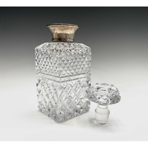 944 - A silver mounted cut glass decanter and stopper, of square section, height 24cm.