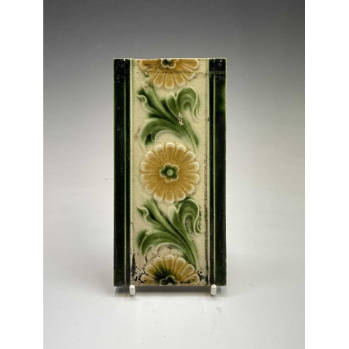 950 - Five Art Nouveau period tiles of square form decorated with stylized flowers, 15 x 15cm, three tiles... 