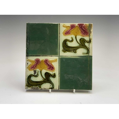 950 - Five Art Nouveau period tiles of square form decorated with stylized flowers, 15 x 15cm, three tiles... 