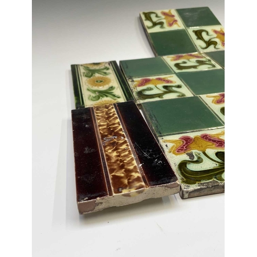 950 - Five Art Nouveau period tiles of square form decorated with stylized flowers, 15 x 15cm, three tiles... 