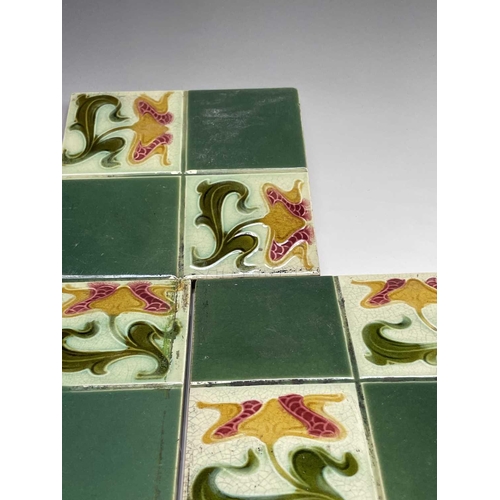 950 - Five Art Nouveau period tiles of square form decorated with stylized flowers, 15 x 15cm, three tiles... 