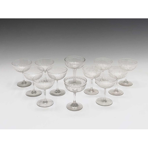 955 - A set of six Edwardian champagne coupes, the bowls with acid etched geometric decoration, a further ... 