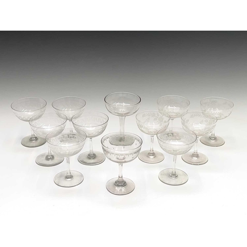 955 - A set of six Edwardian champagne coupes, the bowls with acid etched geometric decoration, a further ... 