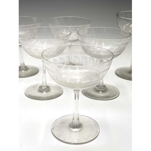 955 - A set of six Edwardian champagne coupes, the bowls with acid etched geometric decoration, a further ... 