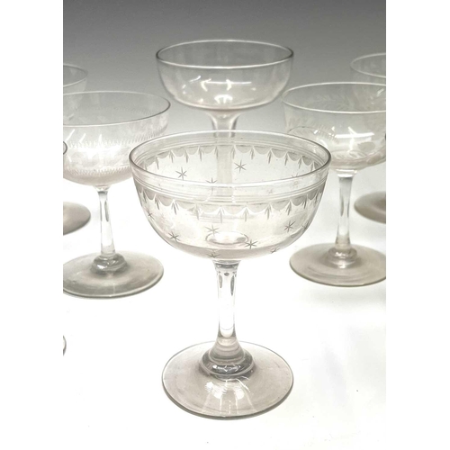 955 - A set of six Edwardian champagne coupes, the bowls with acid etched geometric decoration, a further ... 