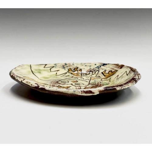 956 - A Ben Fosker (b.1960) slip decorated earthenware plate painted with an owl, painted 'B' mark verso. ... 