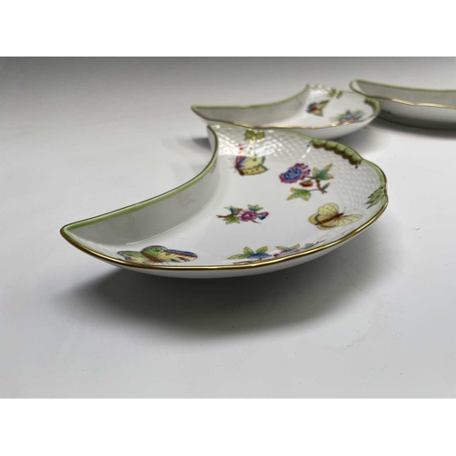 963 - Four Herend Queen 'Victoria Green' pattern crescent plates decorated with butterflies and floral spr... 