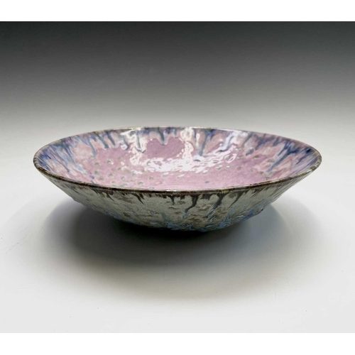 968 - A studio pottery bowl probably by Maggie Barnes with contrasting colourful decoration to the interio... 