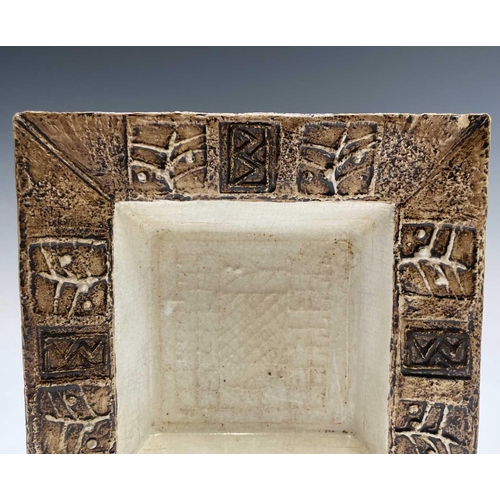 974 - A Troika pottery square dish, the coffee coloured rim with incised decoration, 16.5cm square, togeth... 