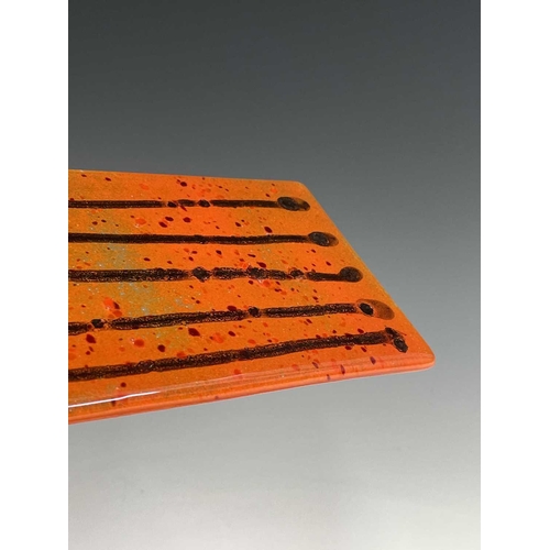 977 - Three studio glass panels, with streaked orange colouring, height 6.5cm (3).