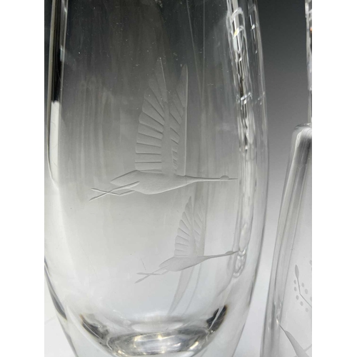 979 - An Orrefors glass vase, engraved with geese in flight, height 19.5cm, together with a similar smalle... 