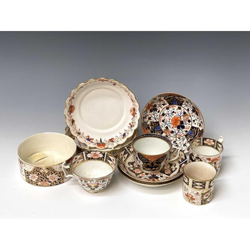 980 - Three Derby porcelain coffee cans and saucers, circa 1820, painted in iron red, blue, green and gilt... 