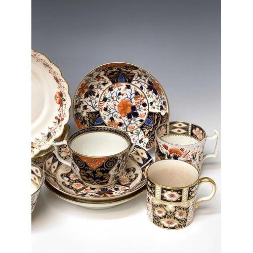 980 - Three Derby porcelain coffee cans and saucers, circa 1820, painted in iron red, blue, green and gilt... 