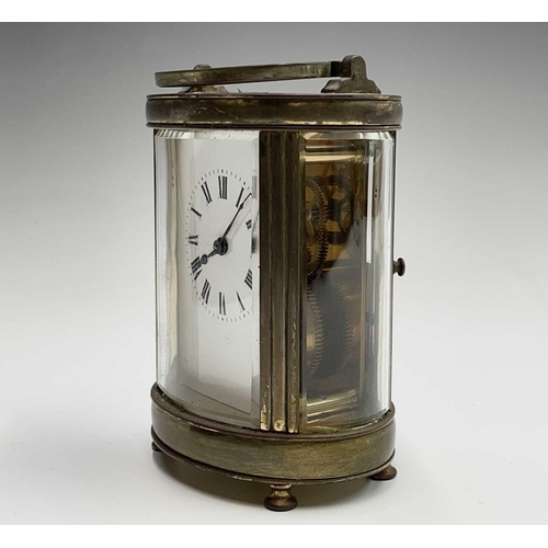 2936 - A French oval brass cased carriage timepiece, early 20th century. Height 12.5cm.