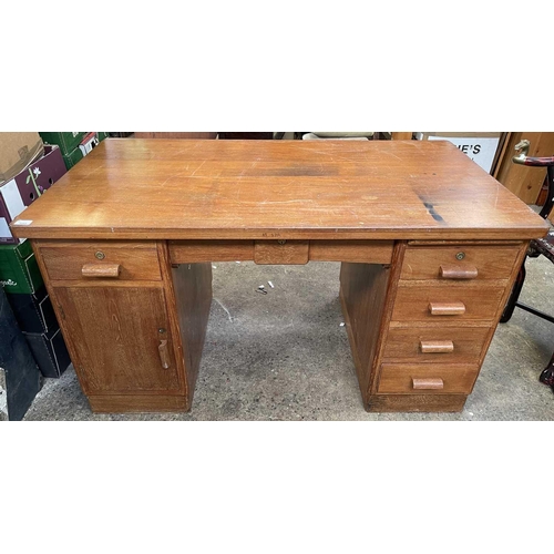 3084 - A teak pedestal desk, fitted with an arrangement of six drawers and a cupboard. Height 75cm, width 1... 