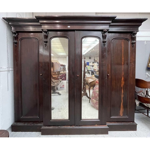 3218 - A Victorian mahogany triple wardrobe.