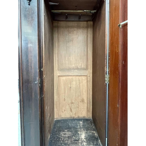 3218 - A Victorian mahogany triple wardrobe.