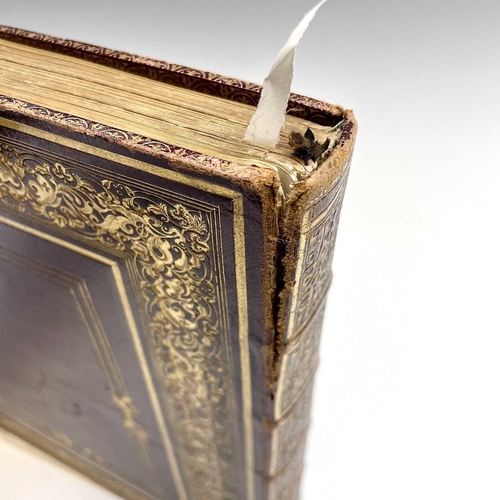 101 - Late 19th century note book, bound in maroon Morocco with ostentatious gilt border and spine, cracki... 