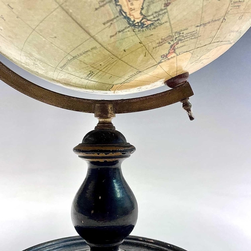 10 - A Philip's 9 inch, terrestrial globe, on a turned ebonised stand, overall height 38cm.