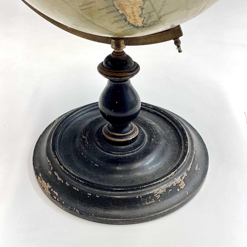 10 - A Philip's 9 inch, terrestrial globe, on a turned ebonised stand, overall height 38cm.