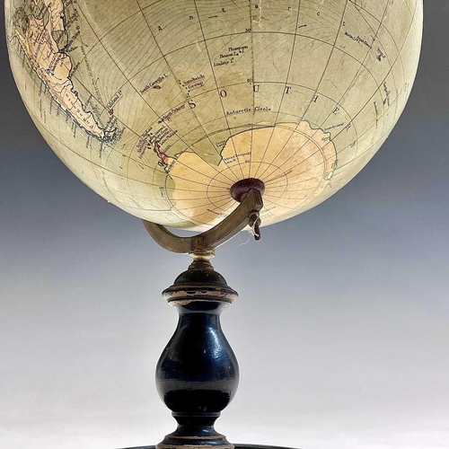 10 - A Philip's 9 inch, terrestrial globe, on a turned ebonised stand, overall height 38cm.